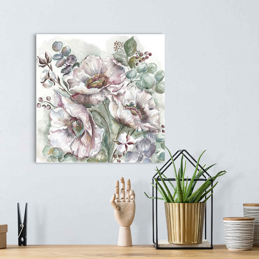 A bohemian room featuring A decorative watercolor painting of a poppy and eucalyptus in subdue tones.