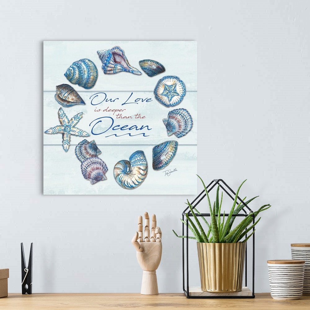A bohemian room featuring "Our Love is deeper than the Ocean" surrounds by a wreath of shells on a gray wood panel background.