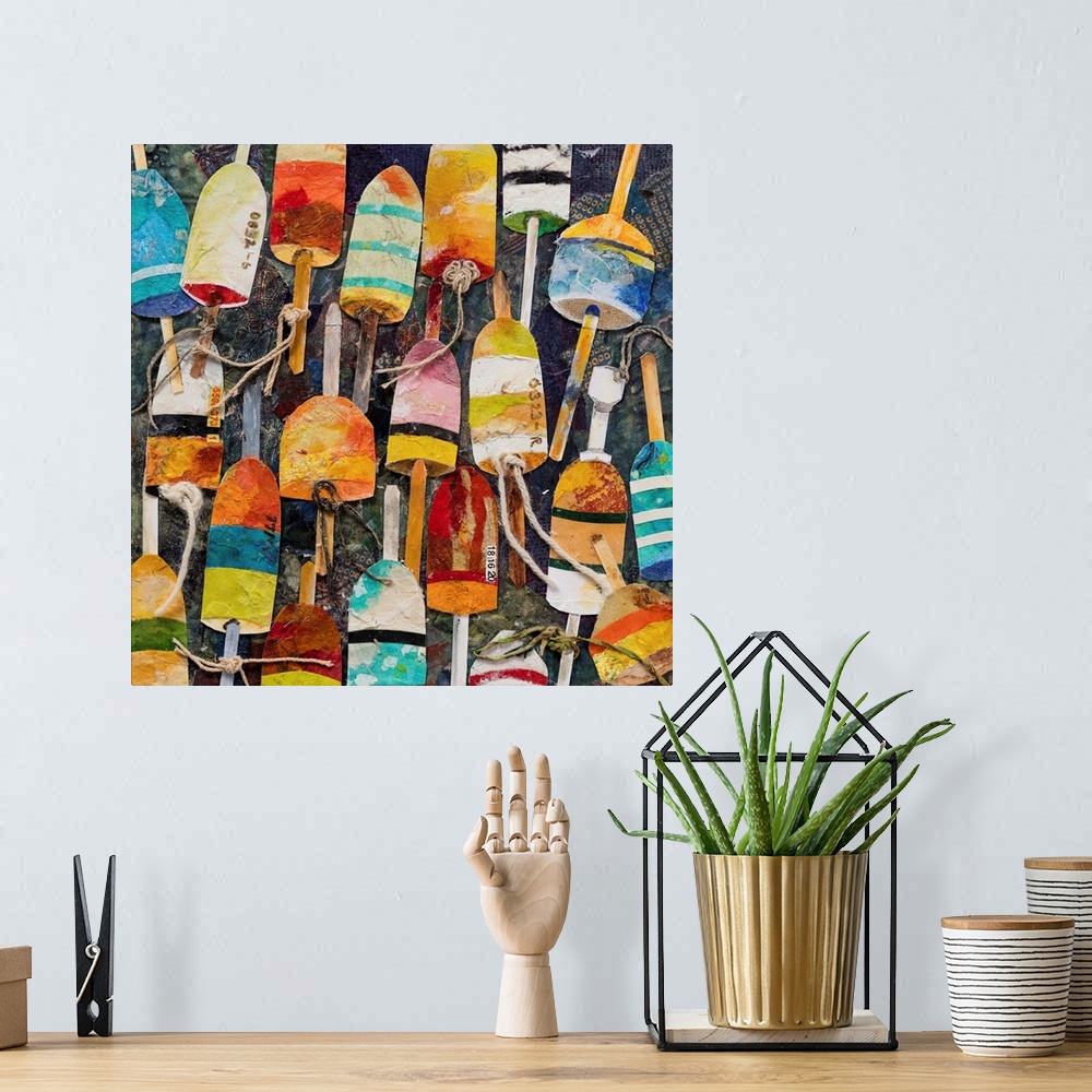 A bohemian room featuring A mixed media painting of water buoys in bright, multiple colors with rope on a dark backdrop.