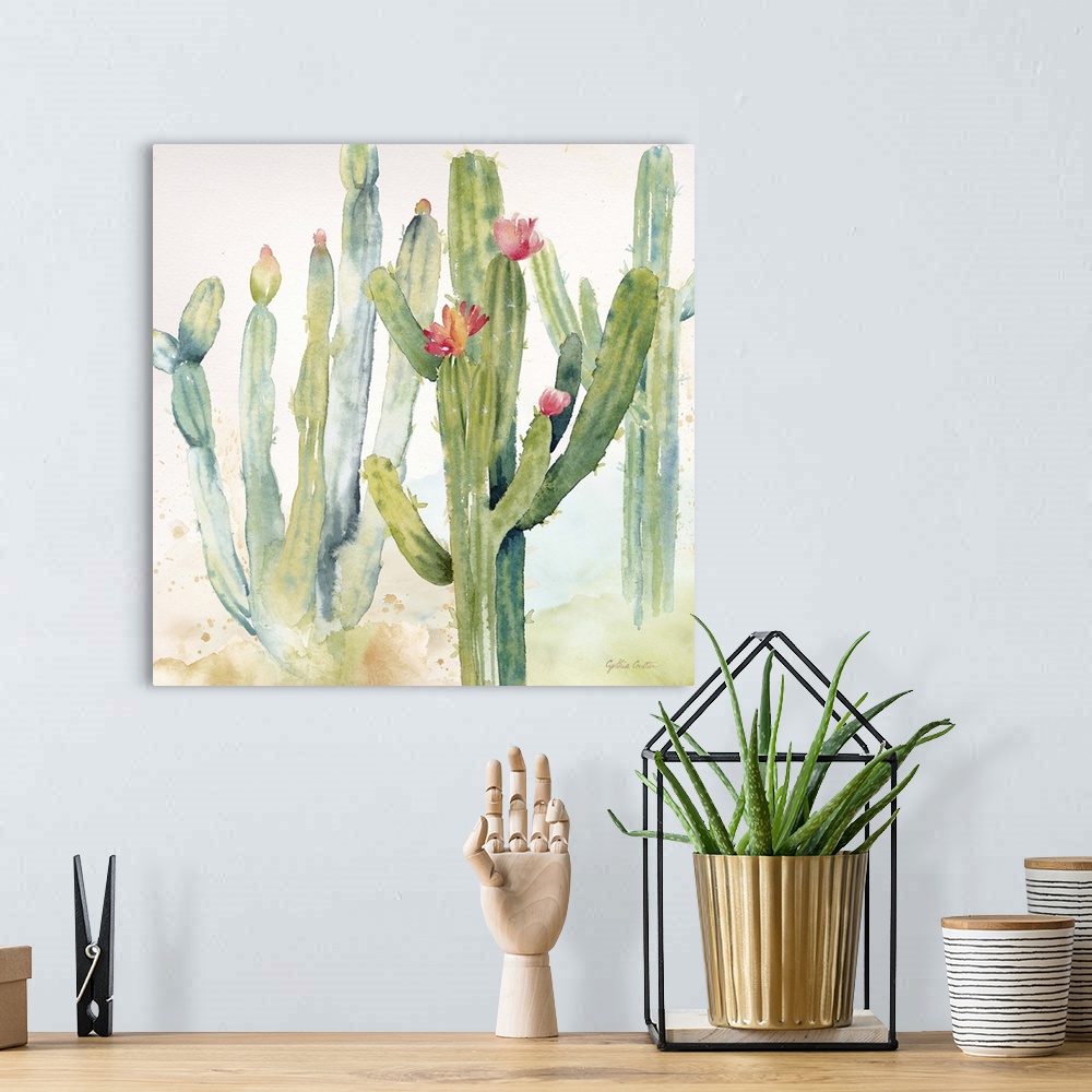 A bohemian room featuring A square decorative watercolor painting of a group of cactus in a garden.