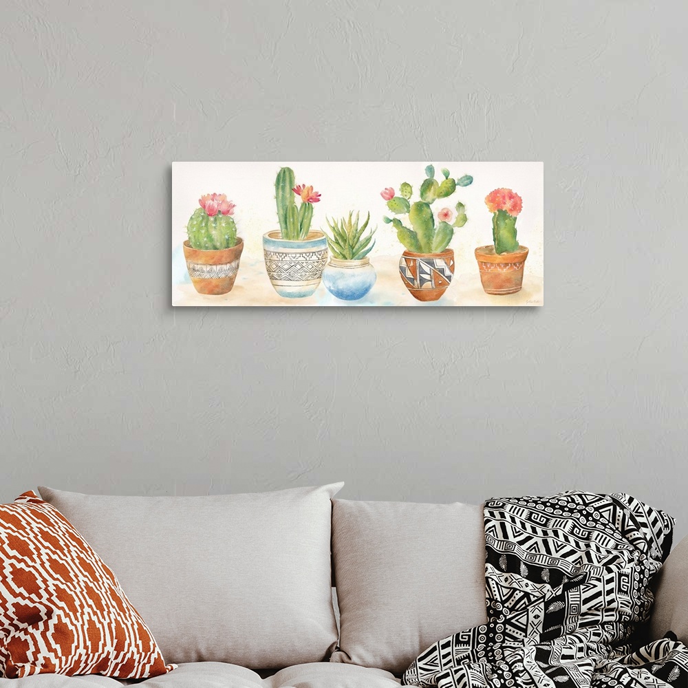 A bohemian room featuring A decorative watercolor painting of a group of succulents in colorful clay pots.