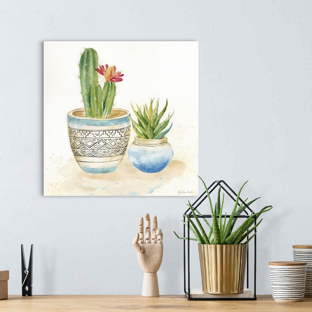A bohemian room featuring A square decorative watercolor painting of a pair of succulents in colorful clay pots.