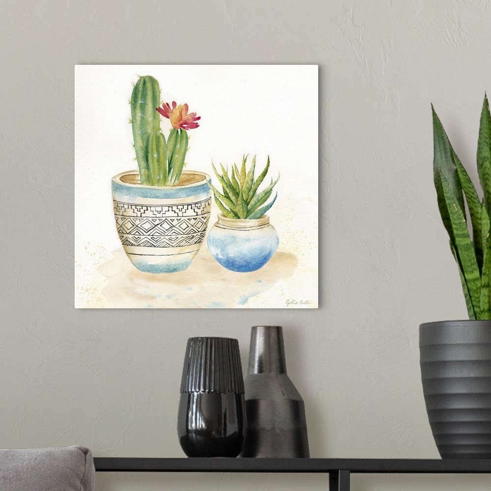 A modern room featuring A square decorative watercolor painting of a pair of succulents in colorful clay pots.