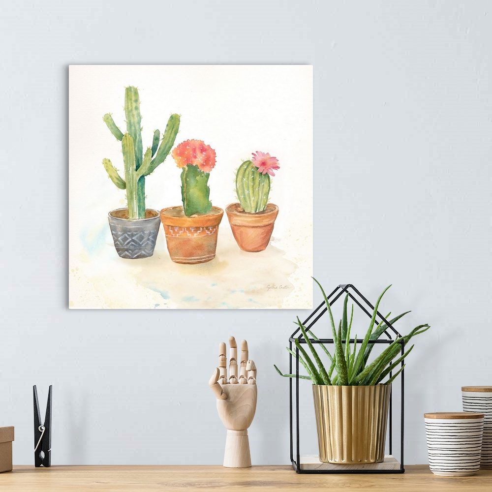 A bohemian room featuring A square decorative watercolor painting of a group of succulents in colorful clay pots.