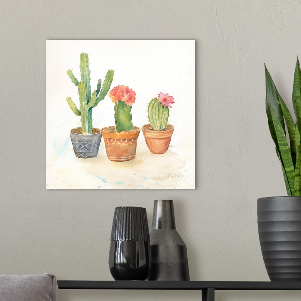 A modern room featuring A square decorative watercolor painting of a group of succulents in colorful clay pots.