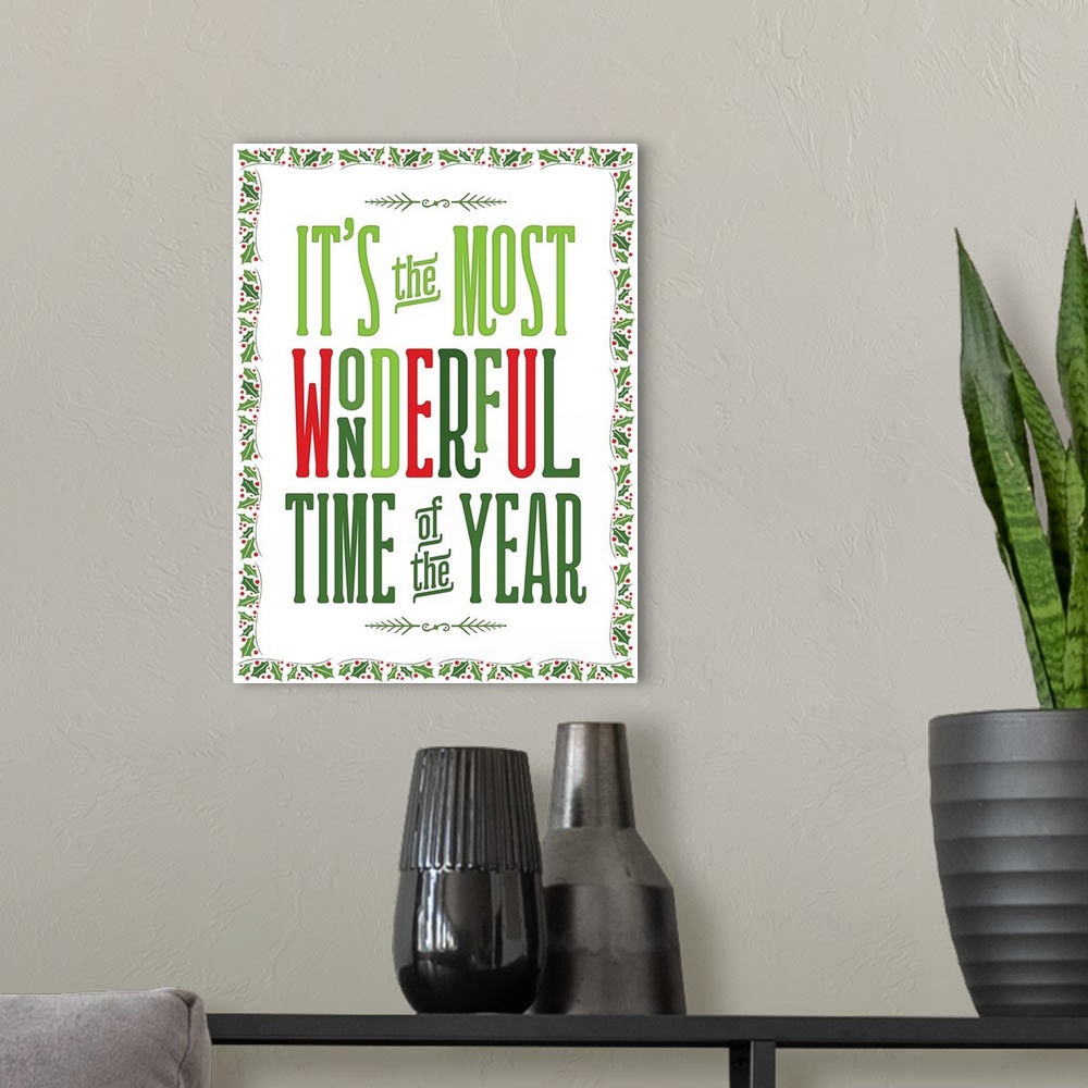 A modern room featuring "It's The Most Wonderful Time Of The Year" in green and red with a holly border.
