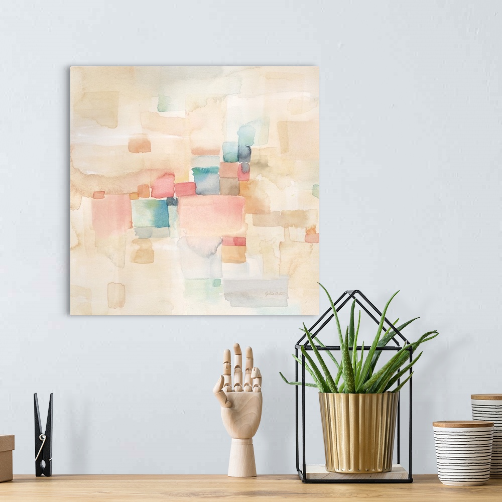 A bohemian room featuring Square abstract watercolor painting in blurred square shapes in muted tones of pink, blue and green.