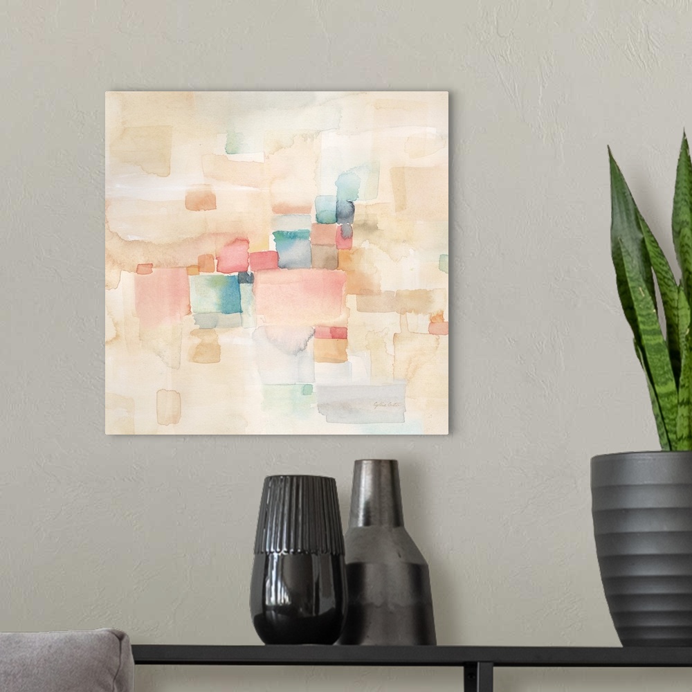 A modern room featuring Square abstract watercolor painting in blurred square shapes in muted tones of pink, blue and green.