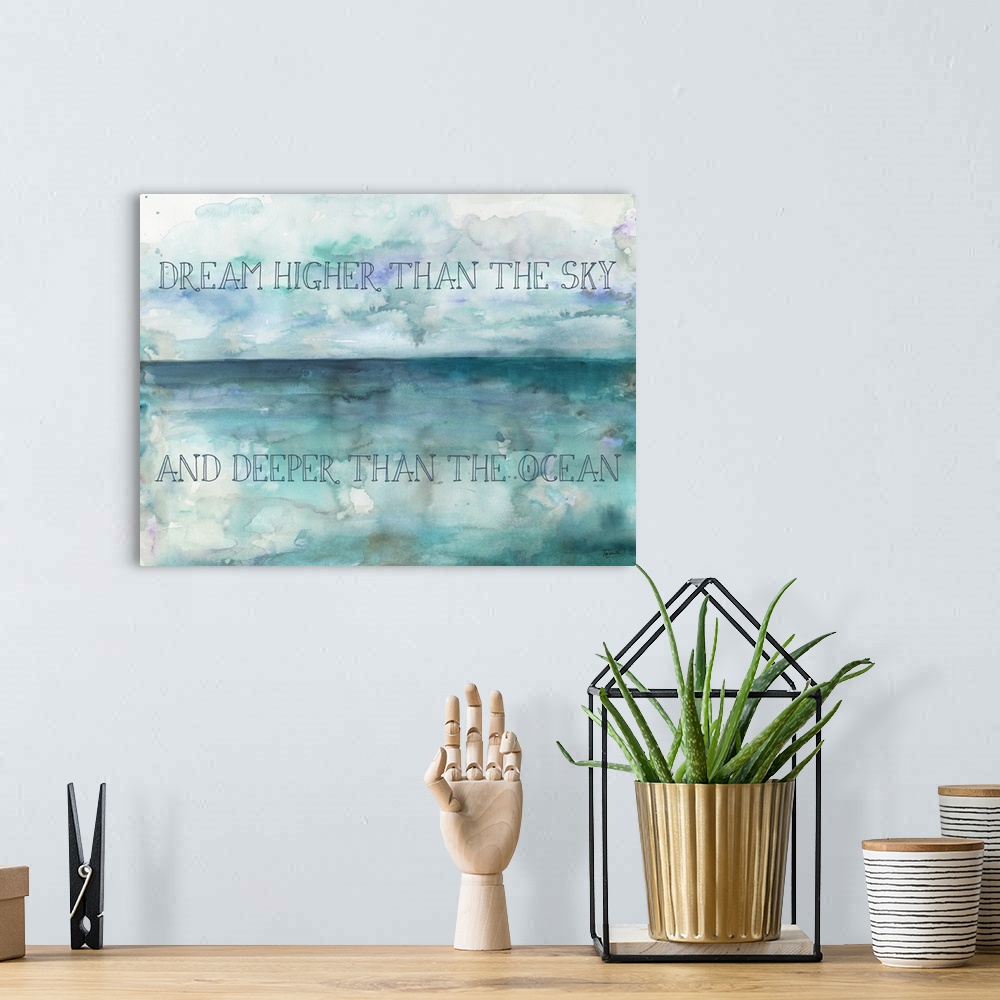 A bohemian room featuring "Dream Higher Than The Sky And Deeper Than The Ocean" on a watercolor painting of blue and purple.