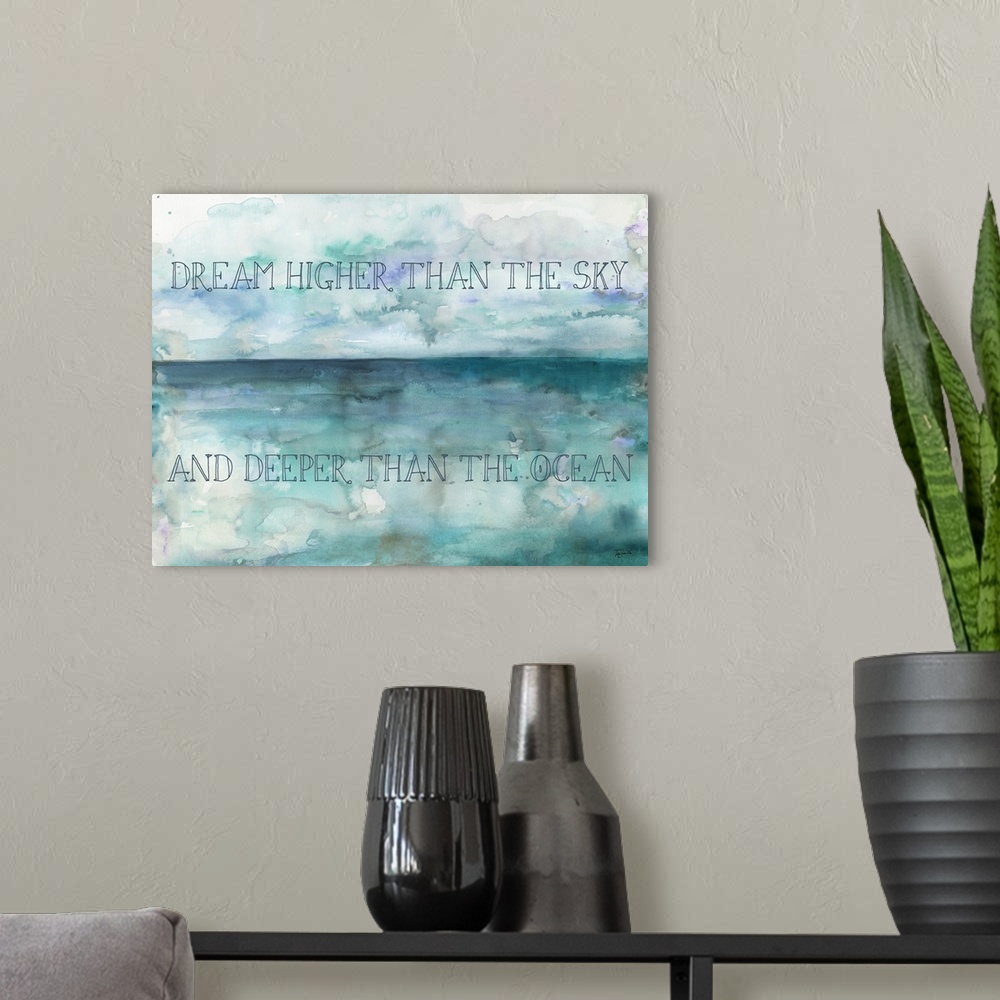 A modern room featuring "Dream Higher Than The Sky And Deeper Than The Ocean" on a watercolor painting of blue and purple.