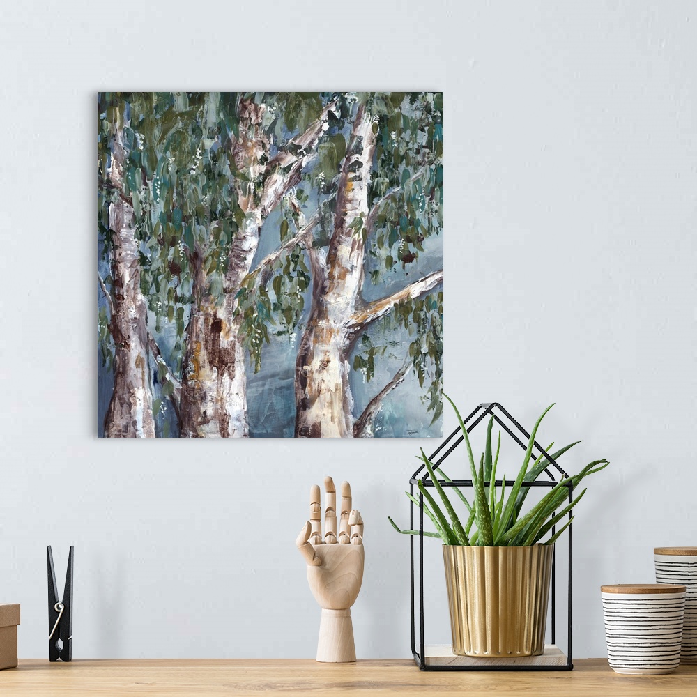 A bohemian room featuring A square contemporary painting of a group of eucalyptus trees in textured muted tones.