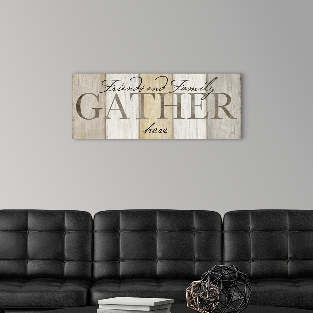 A modern room featuring "Friends and Family Gather here" on a neutral multi-colored wood plank background.