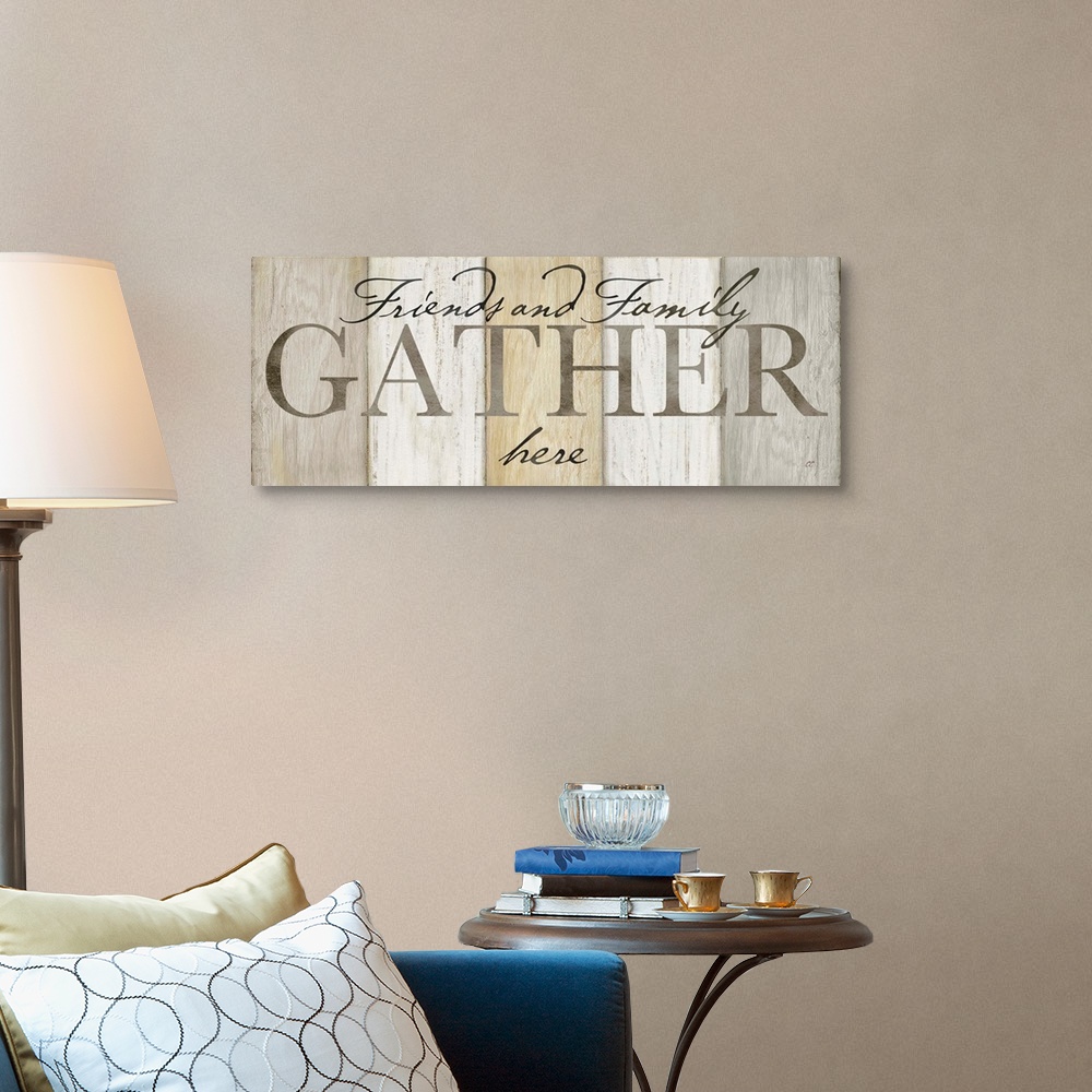 A traditional room featuring "Friends and Family Gather here" on a neutral multi-colored wood plank background.