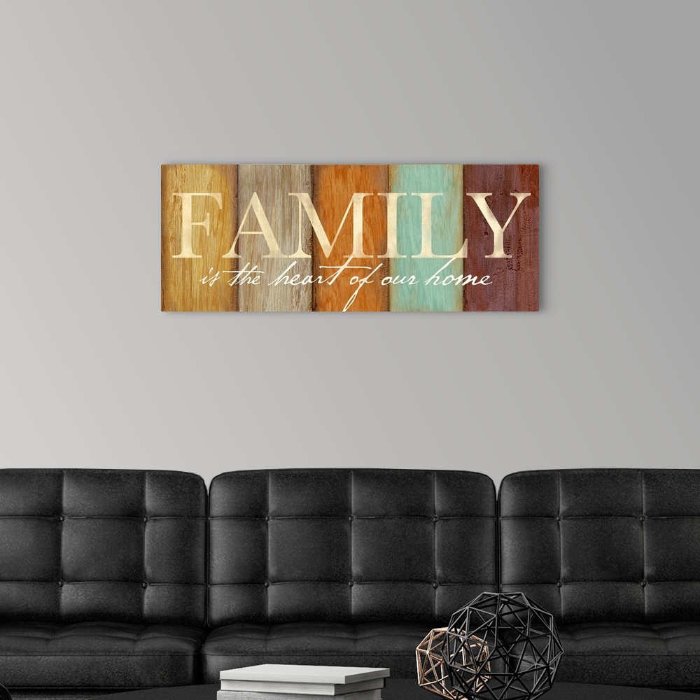 A modern room featuring "Family is the heart of our home" on a multi-colored wood plank background.