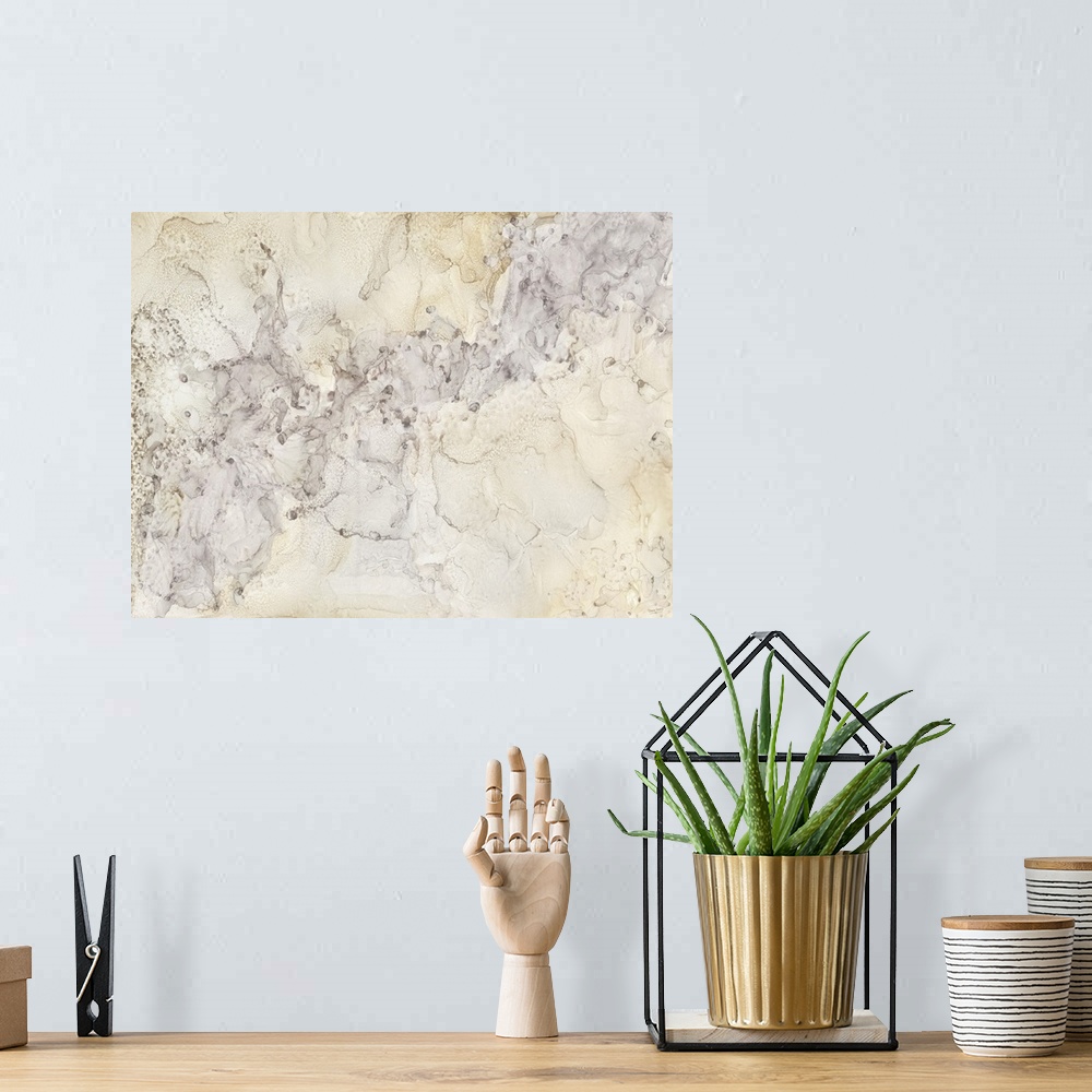 A bohemian room featuring Horizontal abstract painting in shades of silver and gold in the style of marble.