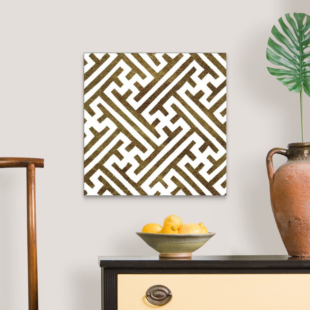 A traditional room featuring Square decorative artwork of dark gold lines in a maze pattern on a white background.