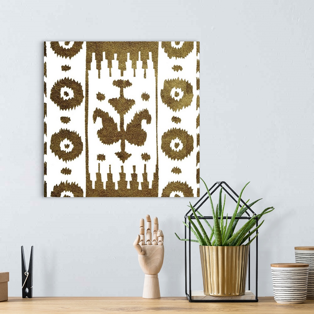 A bohemian room featuring Square decorative artwork of dark gold floral patterns on a white background.