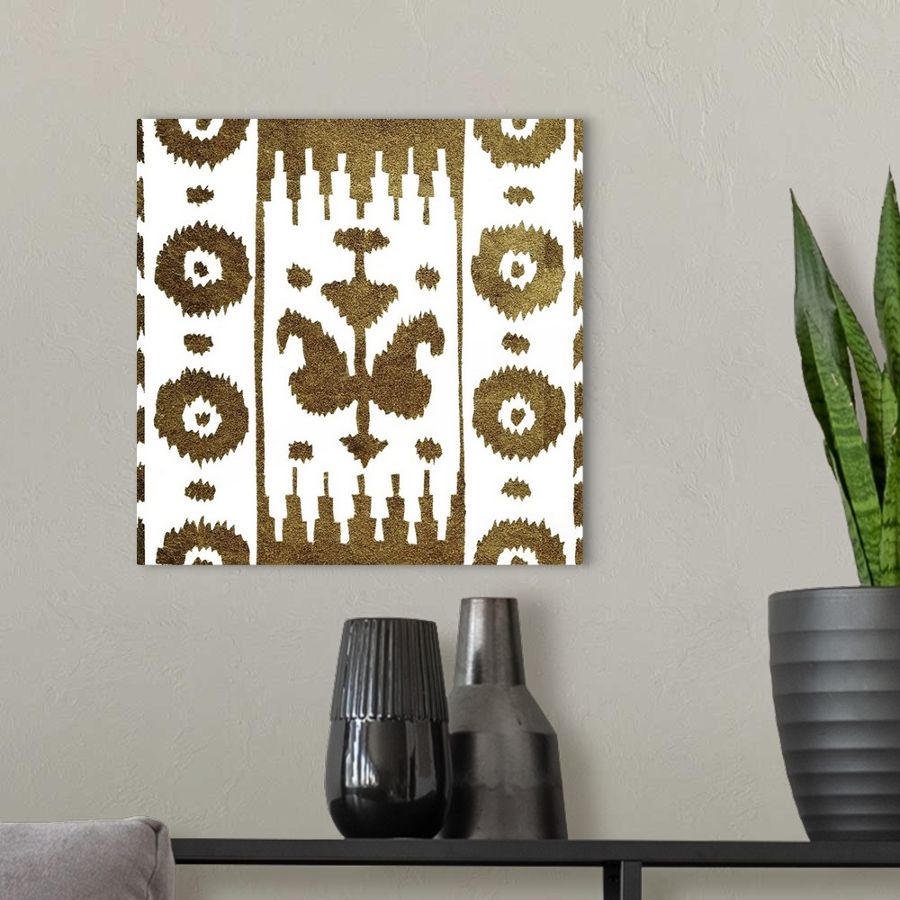 A modern room featuring Square decorative artwork of dark gold floral patterns on a white background.