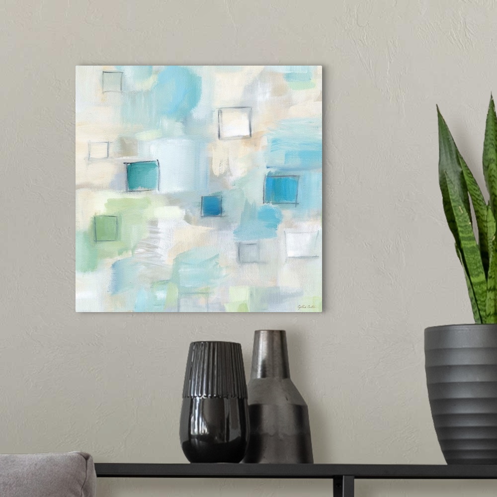 A modern room featuring Square abstract watercolor painting in blurred square shapes in muted tones of brown, blue and gr...