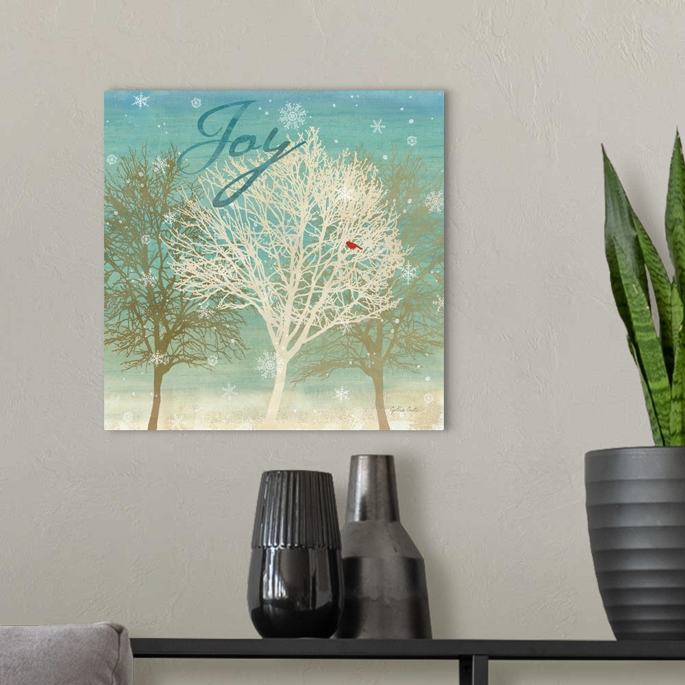 A modern room featuring "Joy" in blue on a group of bare trees with a red bird as snowflakes fall.