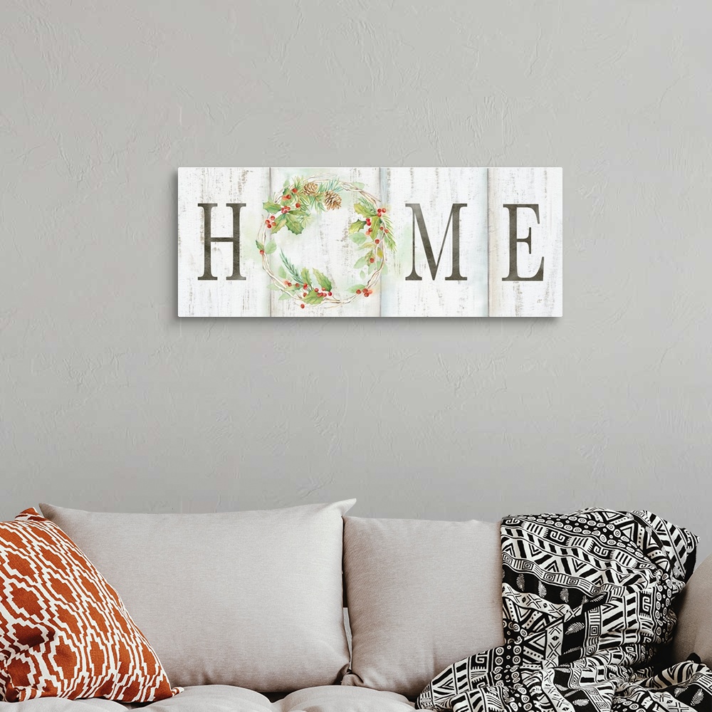 A bohemian room featuring "Home" with a holiday wreath of pine and holly on a white wood background.