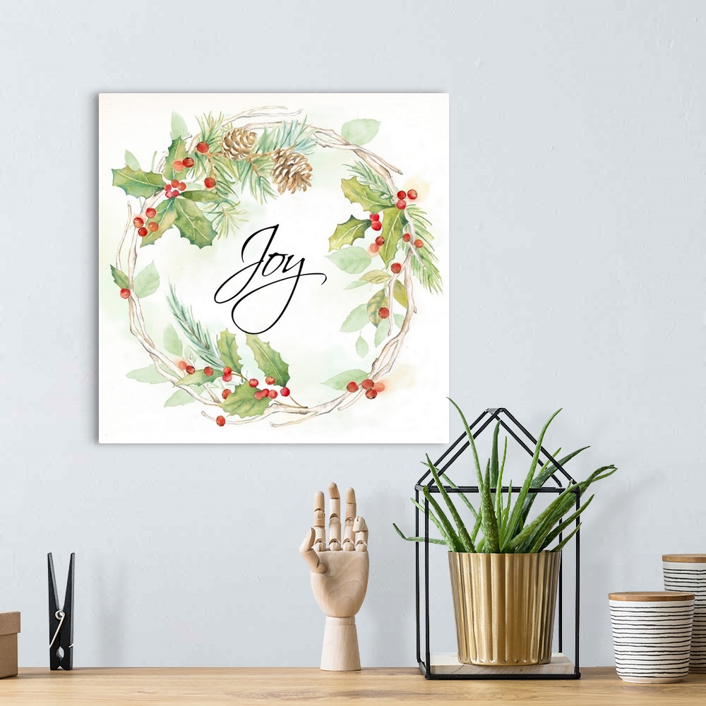 A bohemian room featuring "Joy" in the center of a holiday wreath of pine and holly.