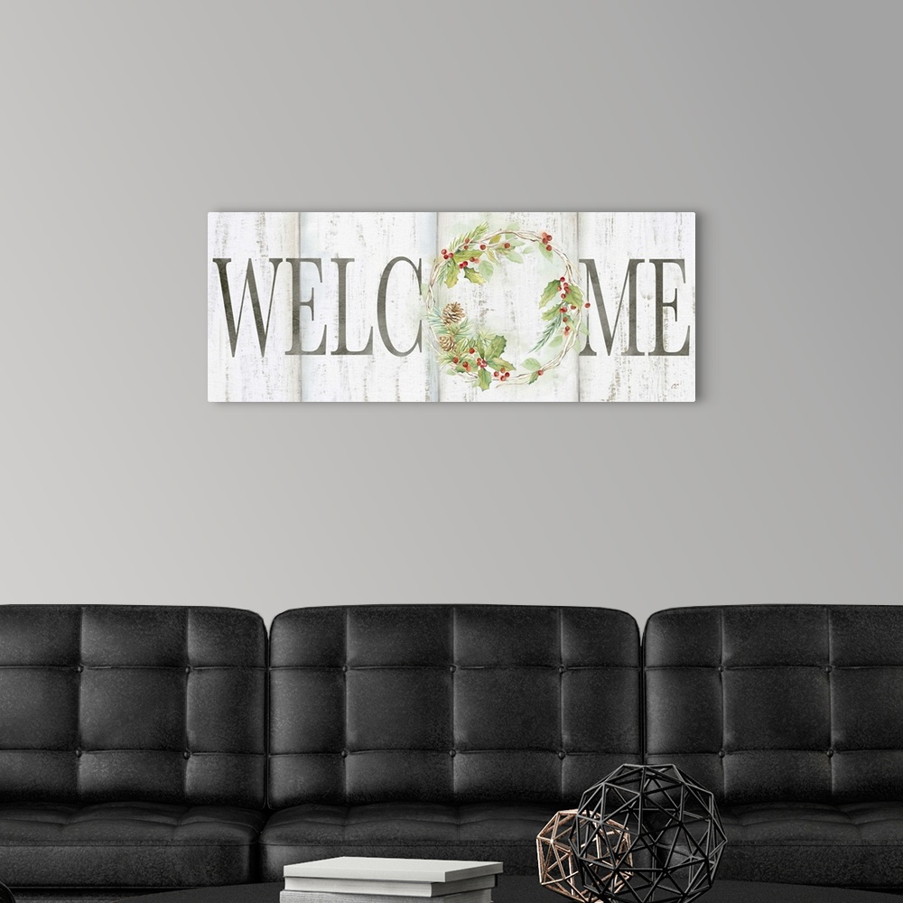 A modern room featuring "Welcome" with a holiday wreath of pine and holly on a white wood background.