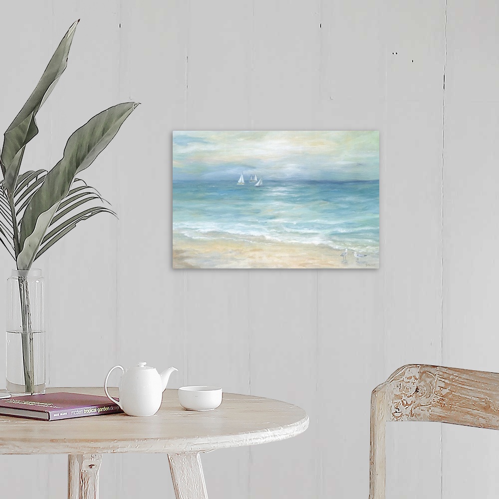 A farmhouse room featuring A contemporary painting of a seascape with sailboats off in the distance and shorebird walking al...