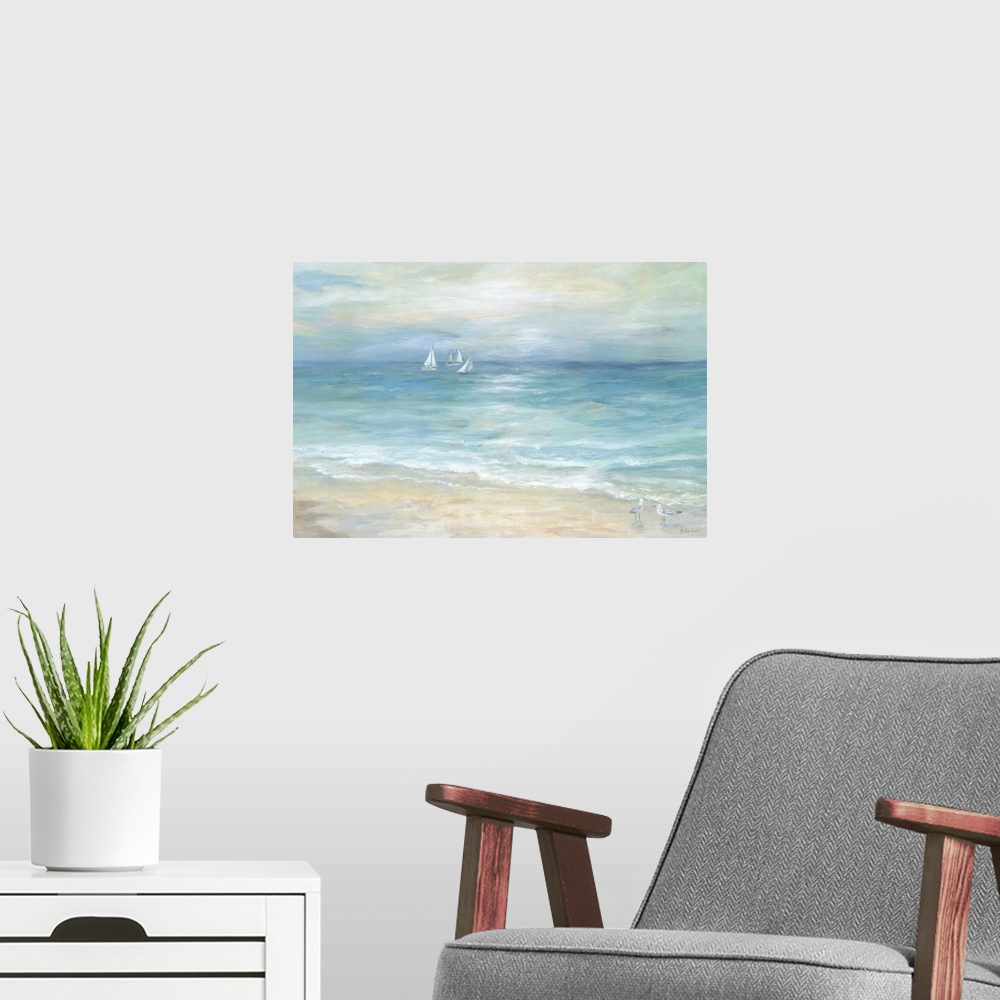 A modern room featuring A contemporary painting of a seascape with sailboats off in the distance and shorebird walking al...