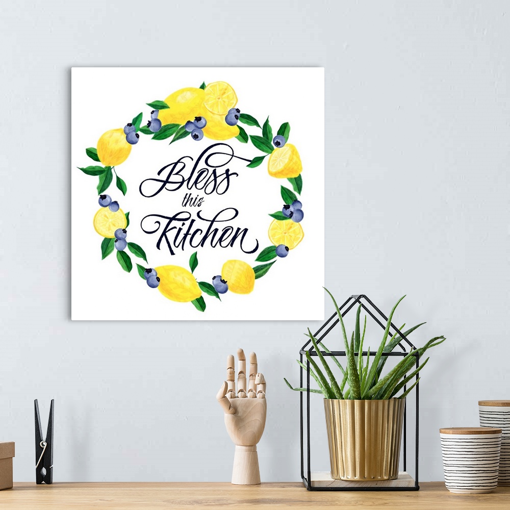 A bohemian room featuring "Bless This Kitchen" in the middle of a wreath made of lemons and blueberries.