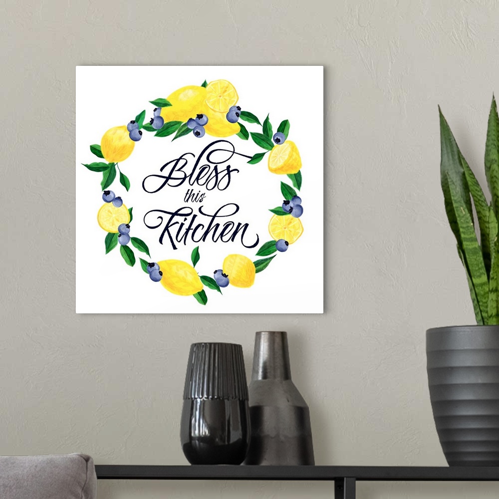 A modern room featuring "Bless This Kitchen" in the middle of a wreath made of lemons and blueberries.