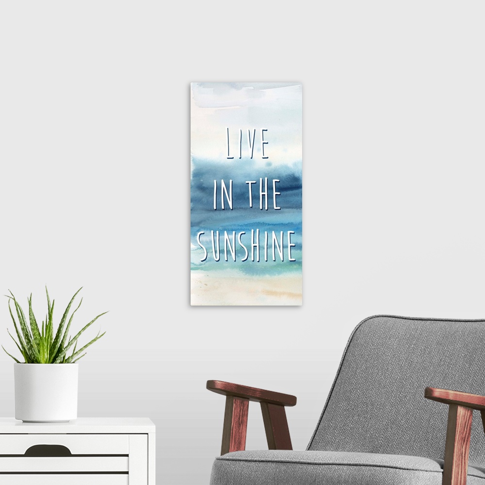 A modern room featuring "Live In The Sunshine" in white on a watercolor painting of the ocean.