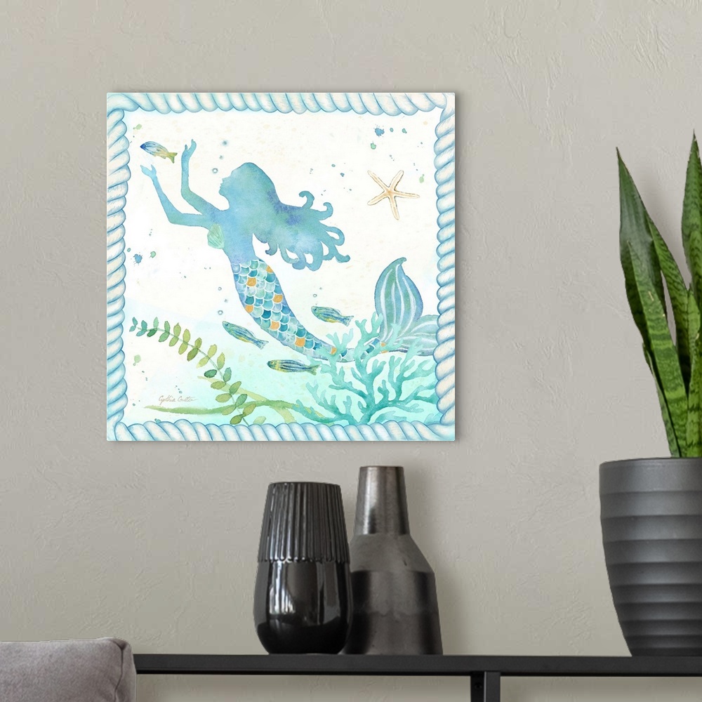 A modern room featuring Watercolor painting of a mermaid surrounded by fish, coral and seaweed along with shells, bordere...