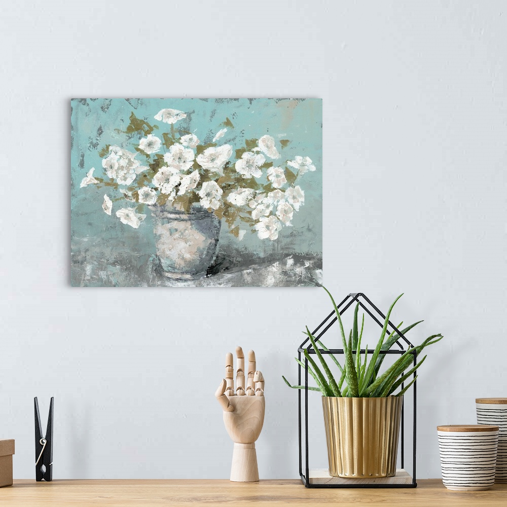 A bohemian room featuring A contemporary still life painting of a vase full of white bloomed flowers with a teal background.