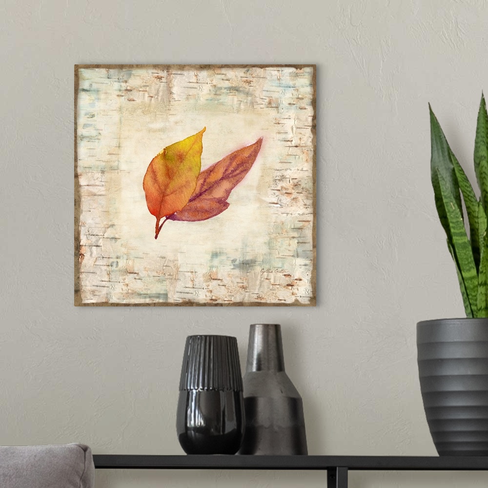 A modern room featuring Decorative artwork of a fall leaf against a wood bark texture with a brown border.