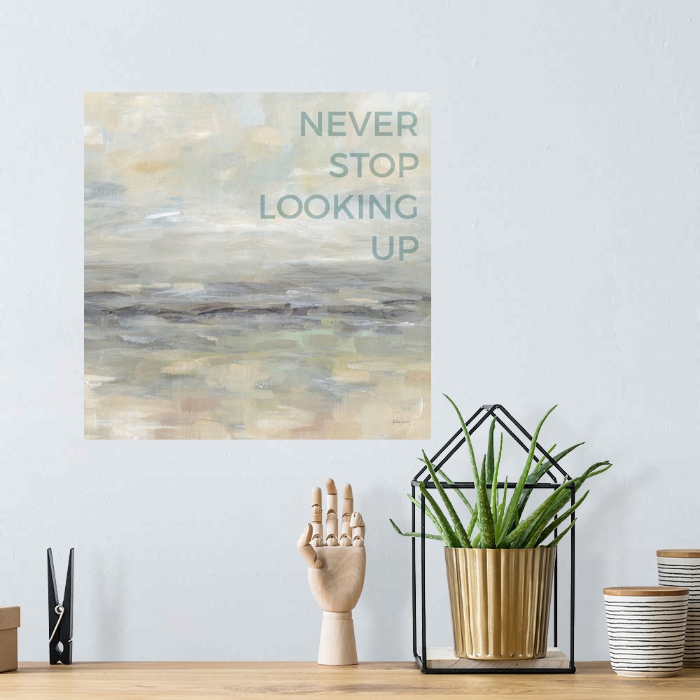 A bohemian room featuring "Never Stop Looking Up " on an abstract painting of textured neutral colors.