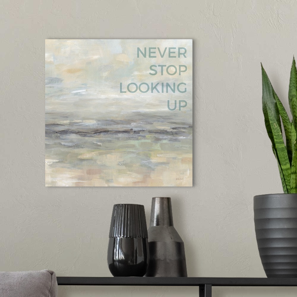 A modern room featuring "Never Stop Looking Up " on an abstract painting of textured neutral colors.