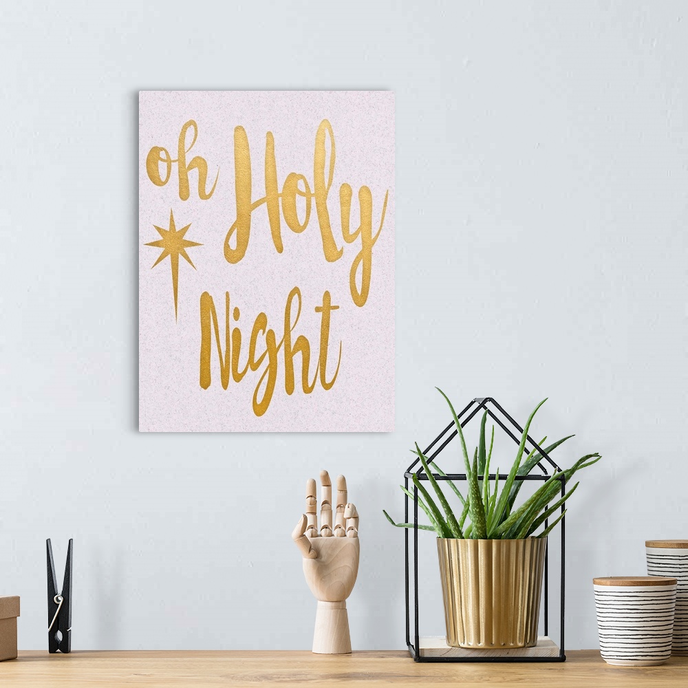 A bohemian room featuring "Oh Holly Night" in gold on a speckled white background.
