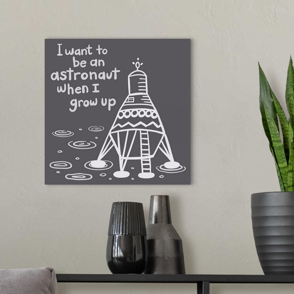A modern room featuring "I want to be an astronaut when I grow up" with a space ship on a dark gray background.