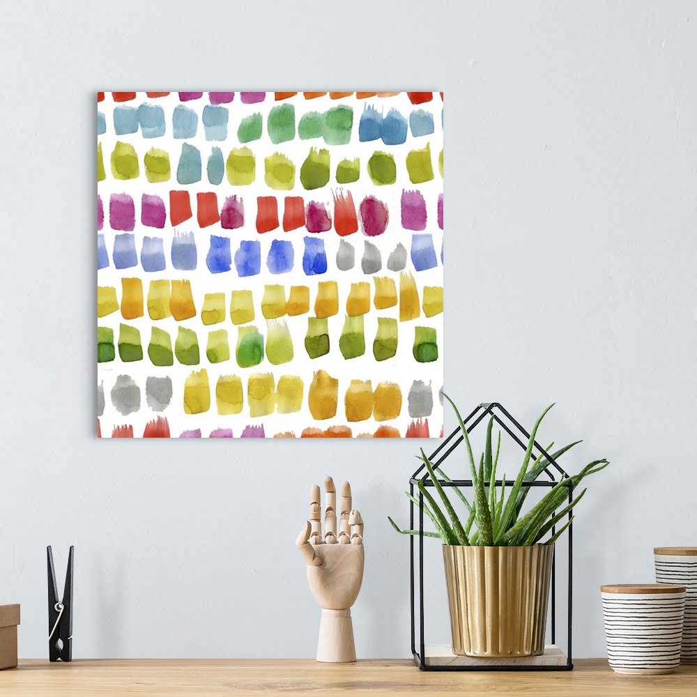 A bohemian room featuring Square decorative artwork of multi-colored brush spots in rows on a white background.