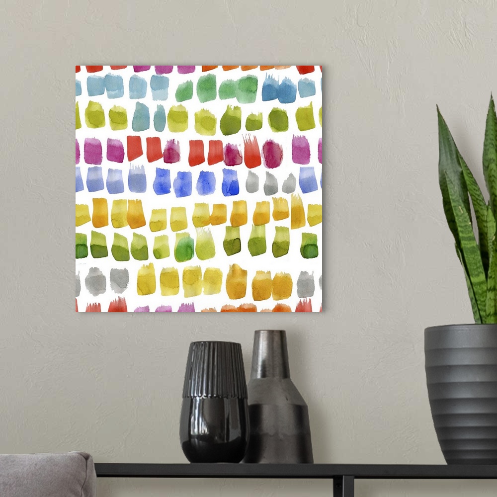 A modern room featuring Square decorative artwork of multi-colored brush spots in rows on a white background.