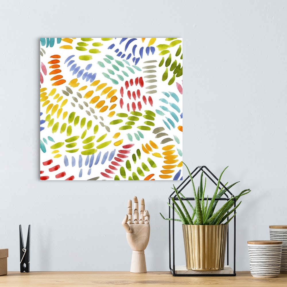 A bohemian room featuring Square decorative artwork of multi-colored brush strokes in a curved pattern on a white background.