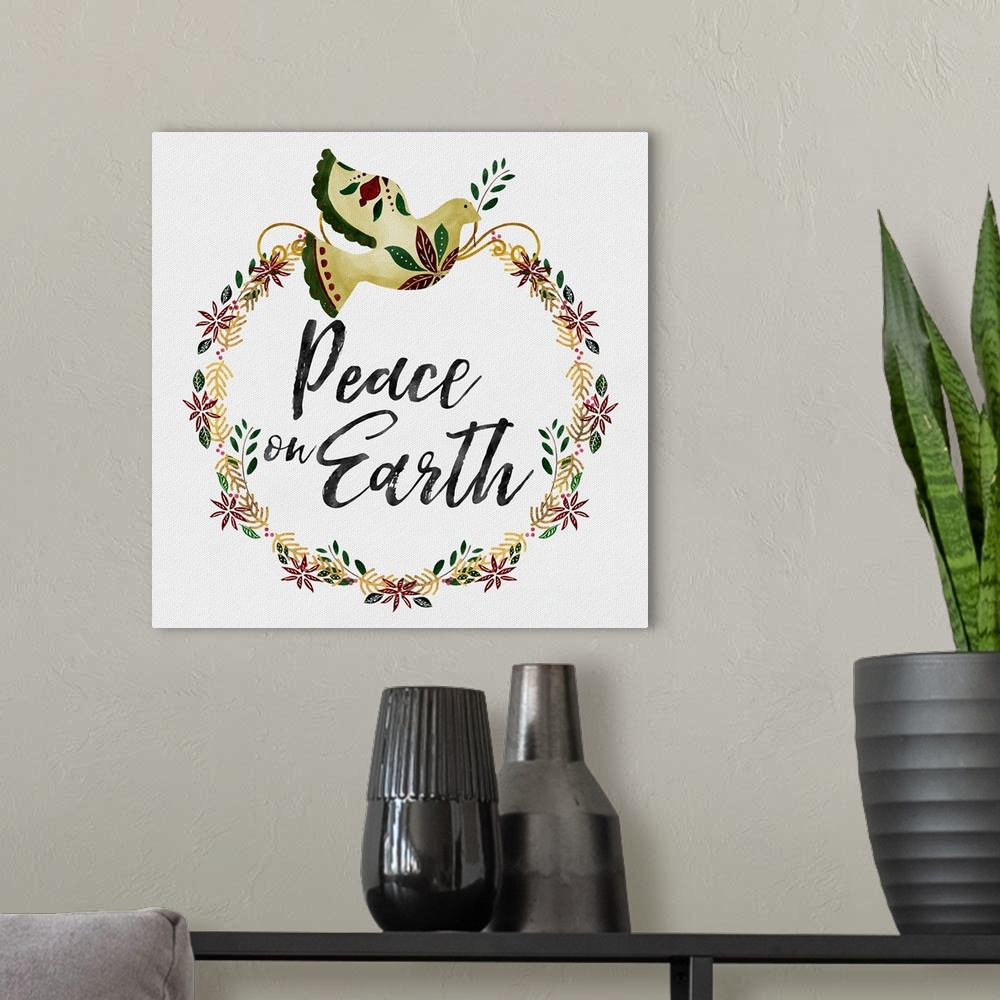 A modern room featuring "Peace On Earth" surrounded by a holiday wreath and golden dove on a white linen backdrop.