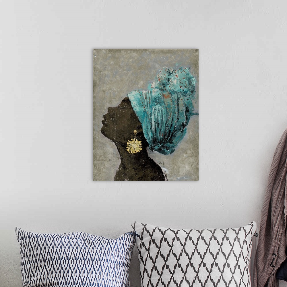 A bohemian room featuring A textured painting of a portrait of a woman with large gold earrings and a colorful head scarf.