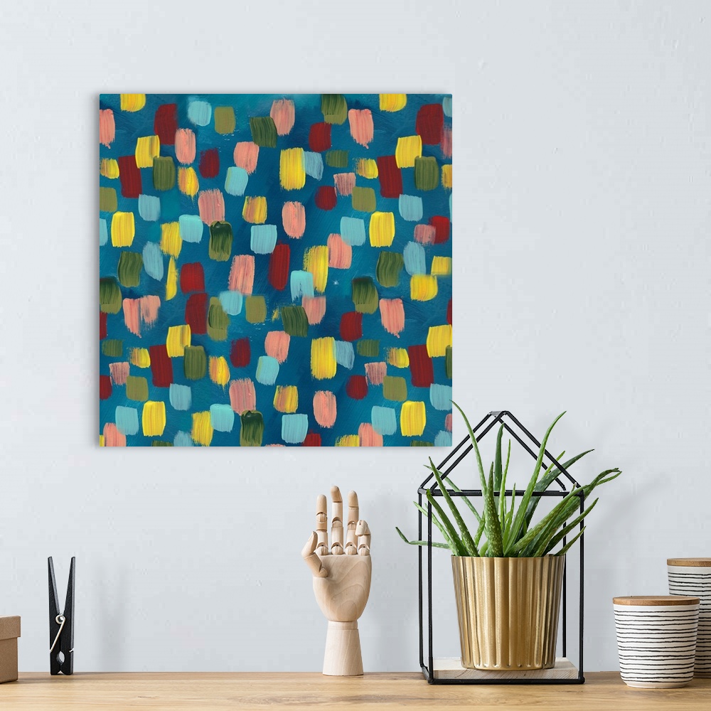 A bohemian room featuring Square contemporary painting of multi-colored spots on a blue background.