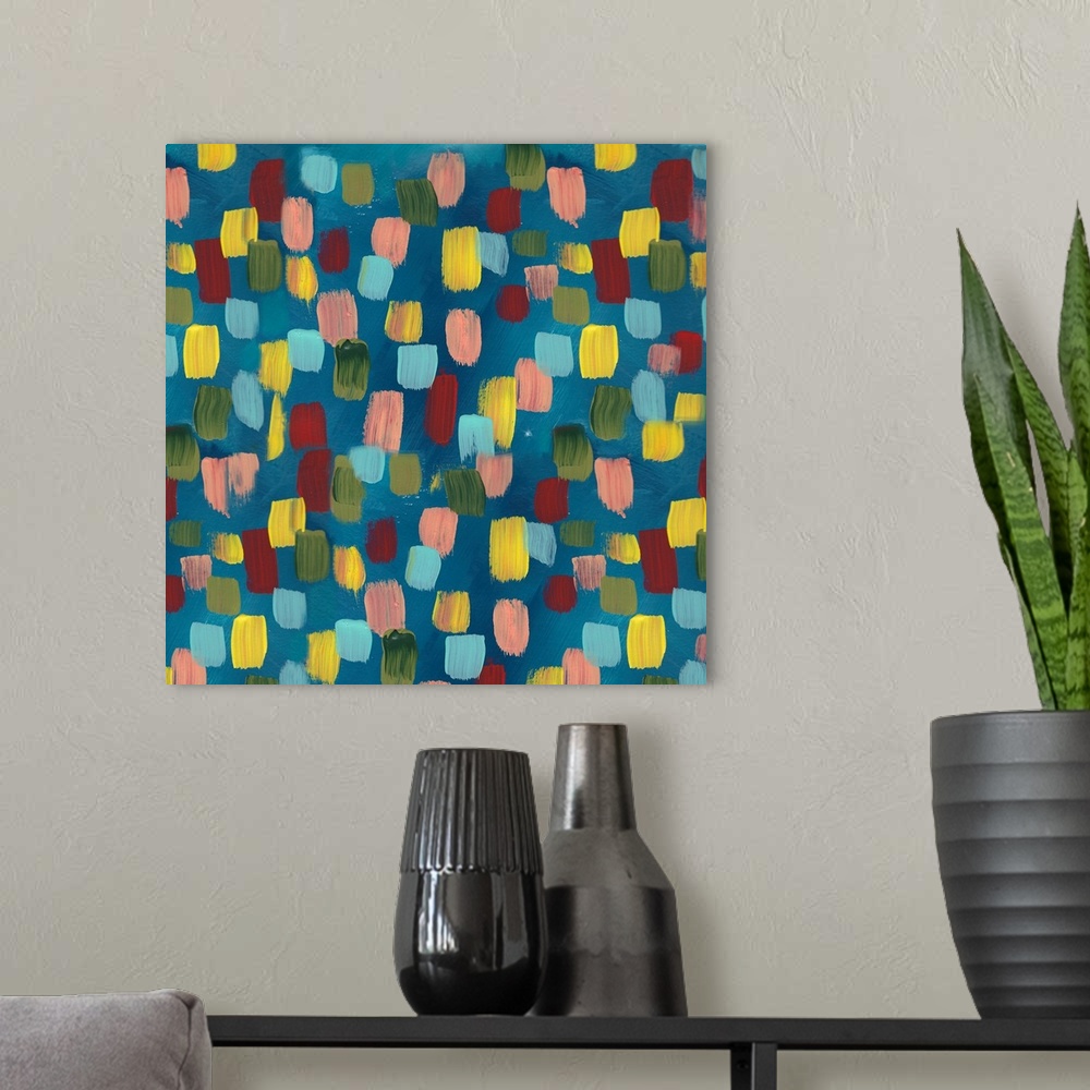 A modern room featuring Square contemporary painting of multi-colored spots on a blue background.