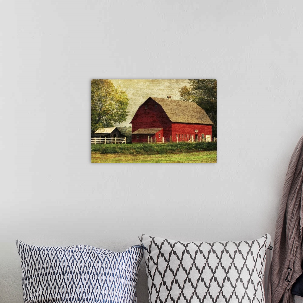 A bohemian room featuring Image of a large red barn framed by trees with a vintage, distressed overlay.