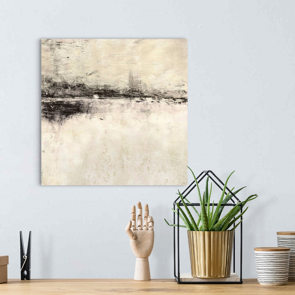 A bohemian room featuring A square abstract painting of a rough stroked black horizontal line on textured beige.