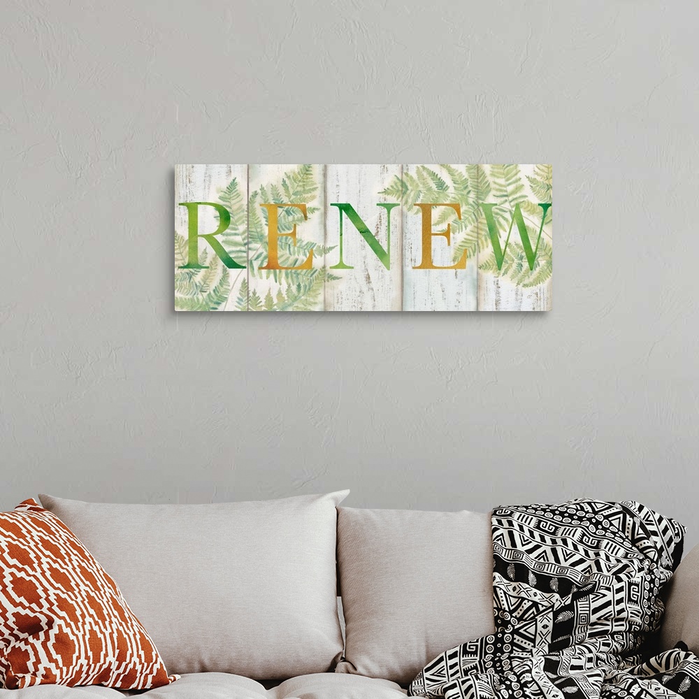 A bohemian room featuring "Renew" in gold and green over a watercolor image of fern leaves with a wood plank appearance.
