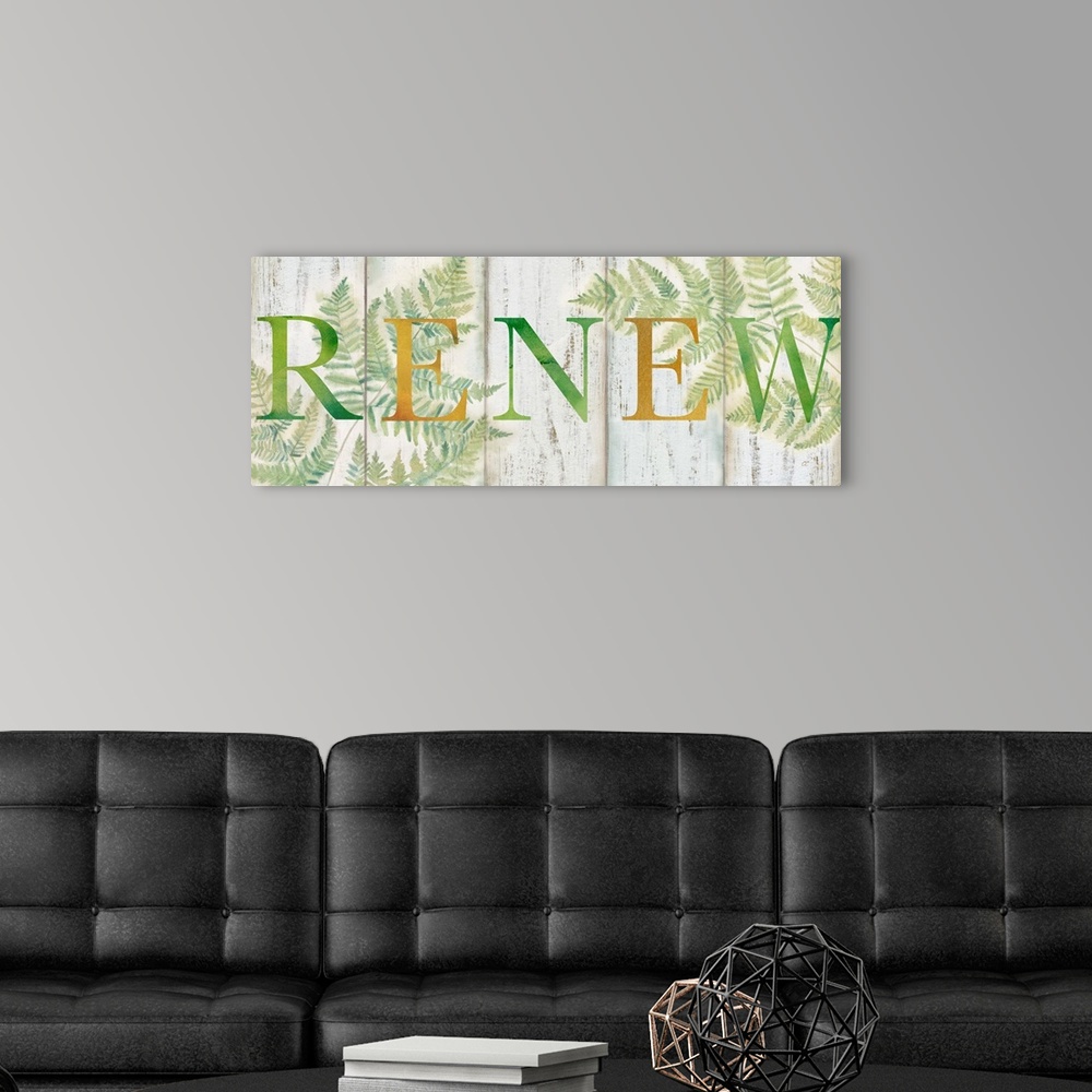 A modern room featuring "Renew" in gold and green over a watercolor image of fern leaves with a wood plank appearance.